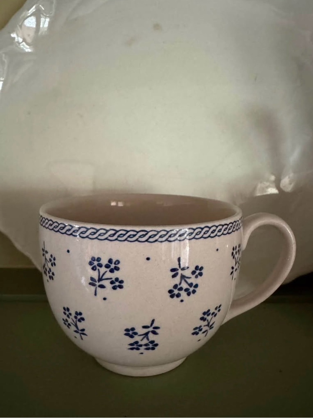 Small blue floral cup, stamped made in England